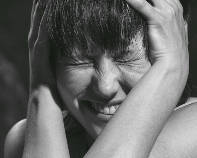 Image of person with face scrunched up in frustration.